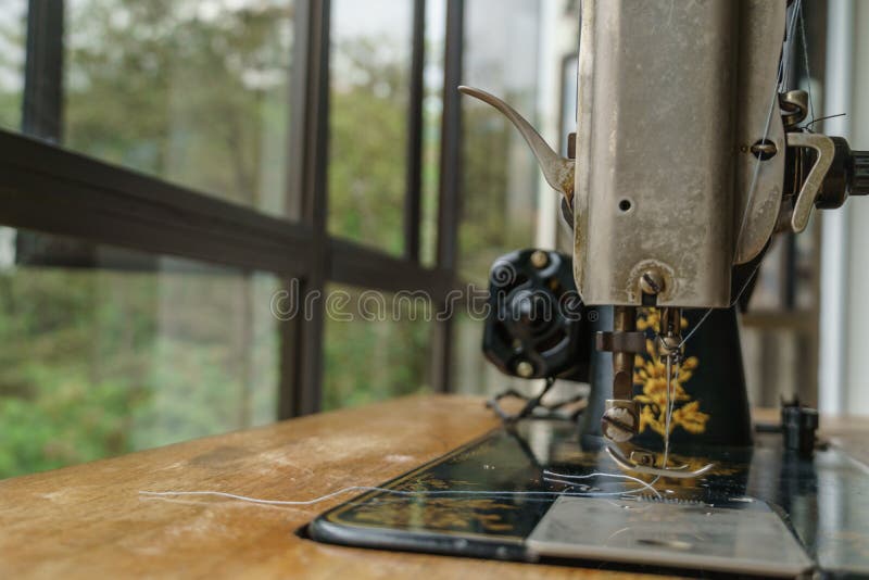 Sewing machine with tread stock photos