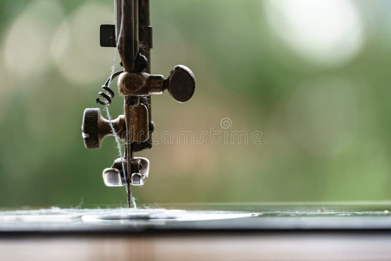 Sewing machine with tread stock image