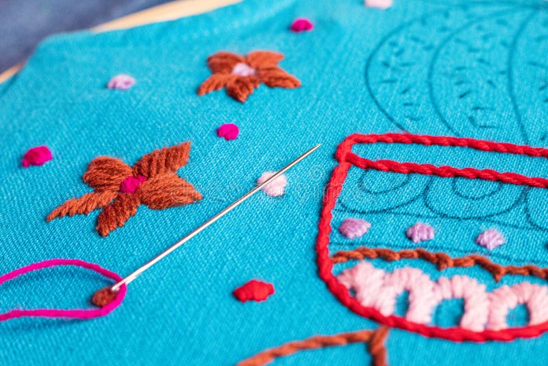 Sewing Needle on Embroidered with Tribal Native Fabric. Sewingpattern