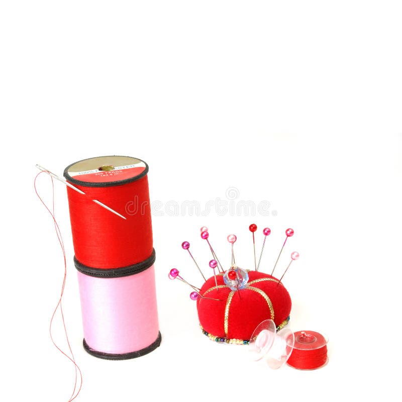Close up of sewing tools. Red pin cushion with many colorful stick pins and  needles. Short pieces of thread. Metal thimble. All on black background  Stock Photo - Alamy