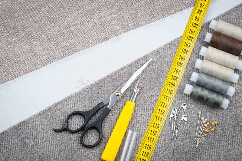 Sewing pattern composition with scissors, spools of thread, pins, measuring tape royalty free stock images Sewing pattern composition with scissors, spools of thread, pins, measuring tape royalty free stock images