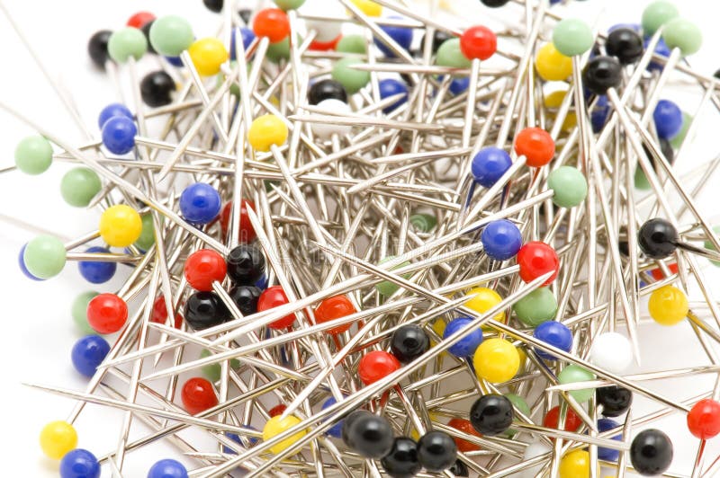 Close up view on lots of sewing pins with colored heads in a metal box on a  wooden table 7999862 Stock Photo at Vecteezy