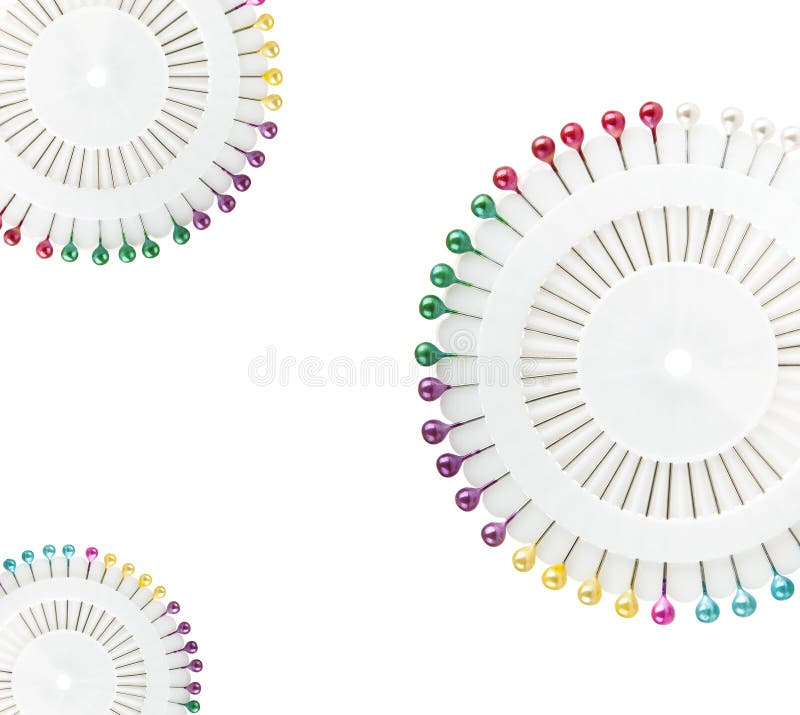 Heap of multi-coloured sewing pins on a white background, Stock image