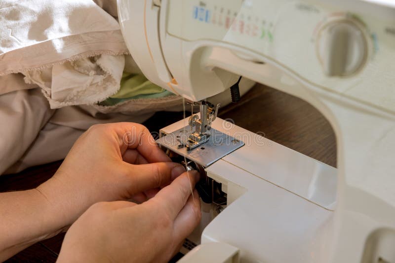 During the Sewing Process, the Seamstress Places the Threads on the Metal Spool in the Sewing