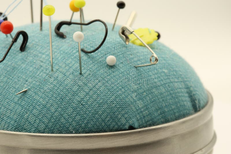 Sewing And Safety Pins On A Blue Pillow Stock Photo Image of