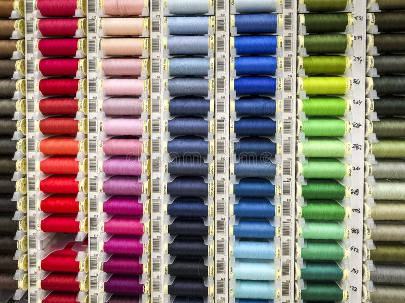 Assorted Colors of Thread on Spools are Sold in the Store. Threads of Various Shades of the Same