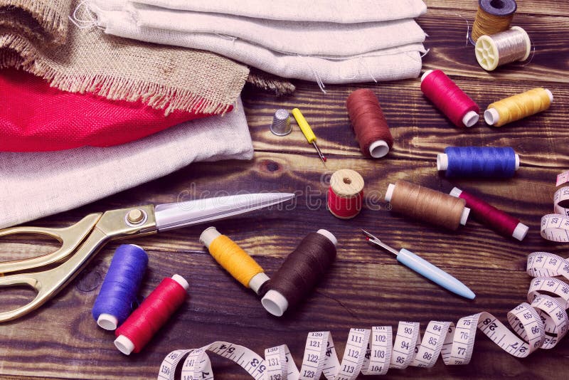 Sewing Tools, Multicoloured Fabric And Threads On A Wooden Background Stock Image Image of
