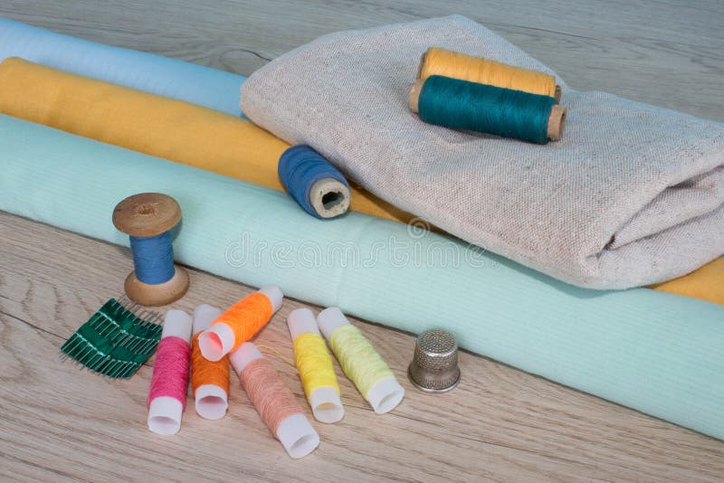 Sewing Tools and Sewing Kit on Wooden Textured Background Stock Image