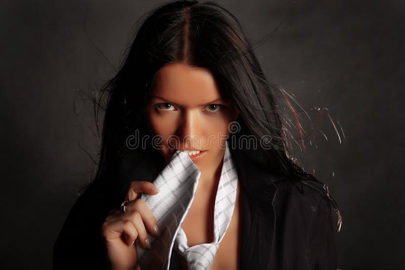 Sexual girl with a white tie on a grey