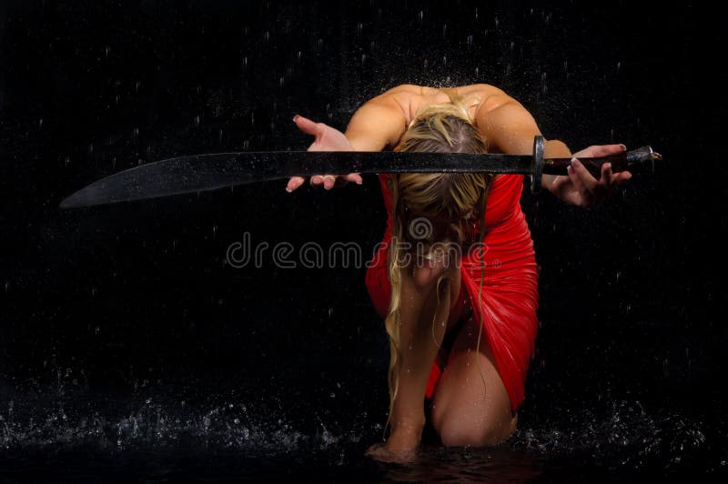 Sexual woman stretches sword