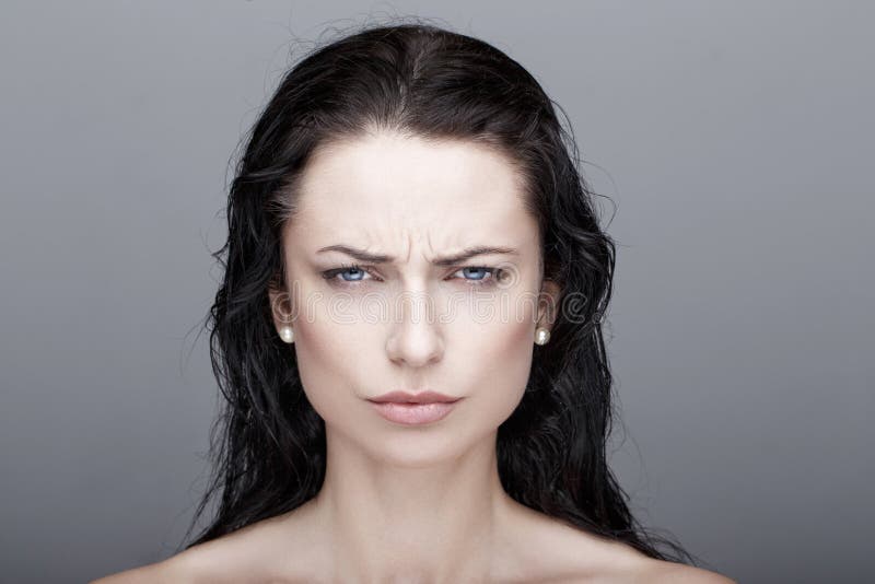 annoyed young brunette woman portrait. annoyed young brunette woman portrait