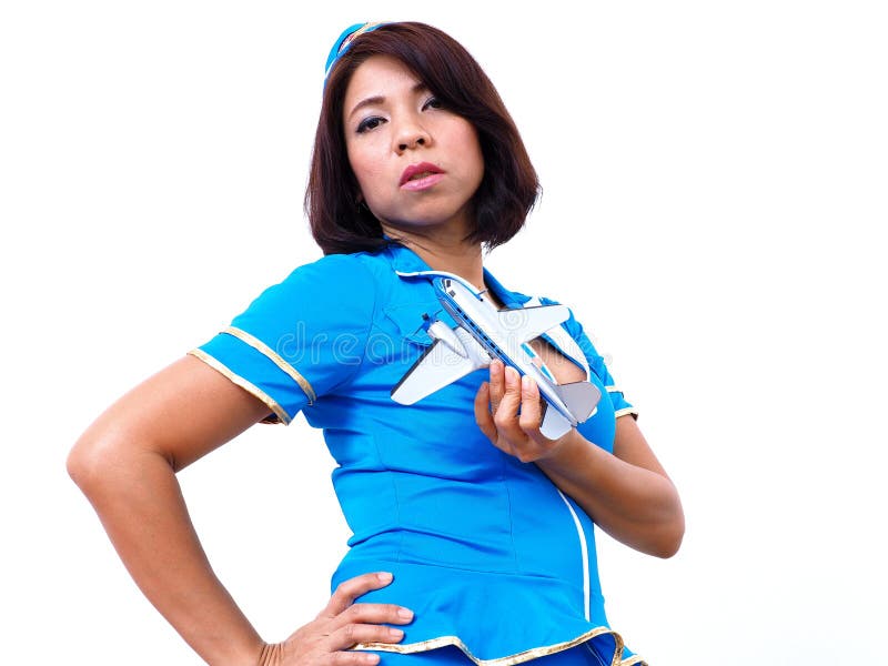Sexy Asiatin trägt Flugbegleiteruniform stockfotografie Sexy Asiatin trägt Flugbegleiteruniform stockfotografie