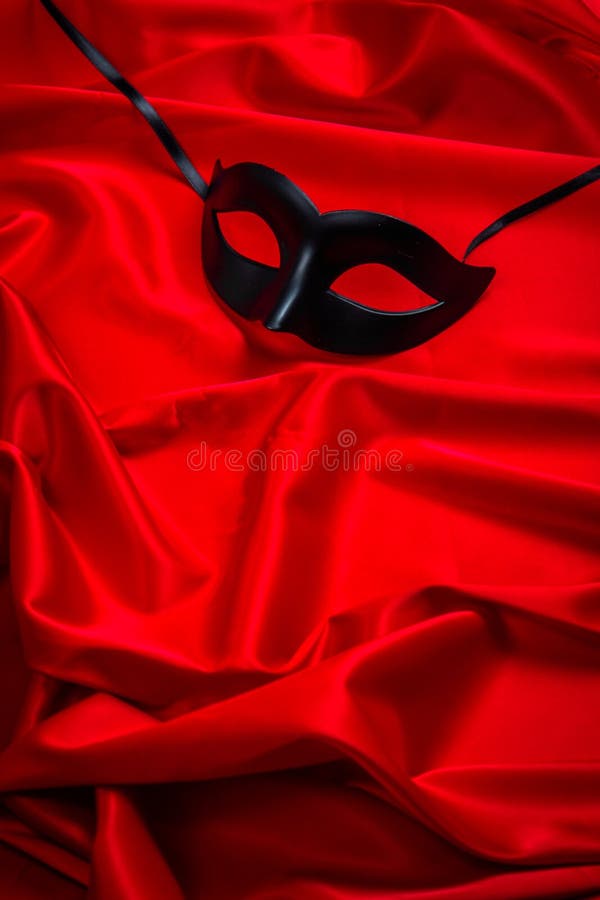 Black Mask on a Red Silky Background Stock Photo - Image of gold, 165301530