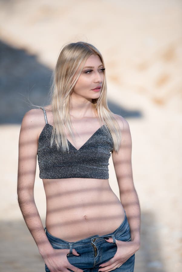 blond woman with flat stomach, shadows lines on her body royalty free stock photo blond woman with flat stomach, shadows lines on her body royalty free stock photo
