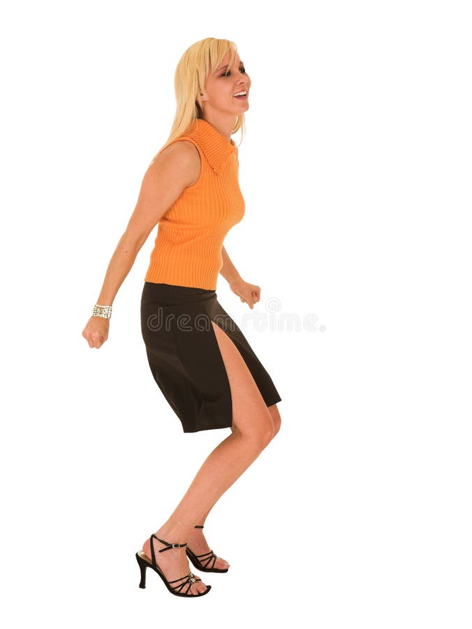 Young adult Caucasian businesswoman in a short black mini skirt with a orange striped top on a white background. Single mini stock images, royalty-free photos and pictures