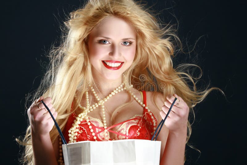 Beautiful blonde with gift. Lovely european female stock images, royalty-free photos and pictures