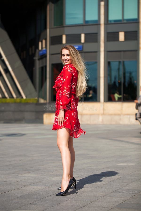 blonde model posing on th street in red summer dress royalty free stock photo blonde model posing on th street in red summer dress royalty free stock photo