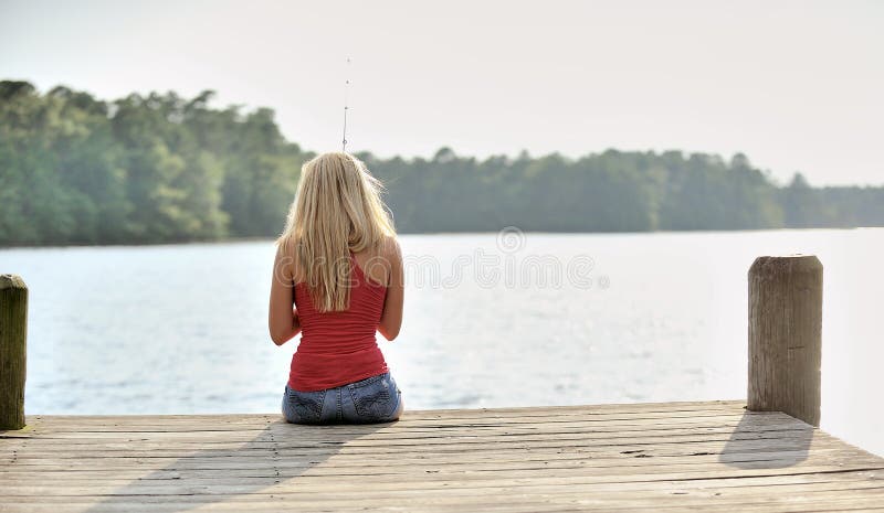 Blonde Woman Fishes from Dock Stock Photo - Image of bright, model ...