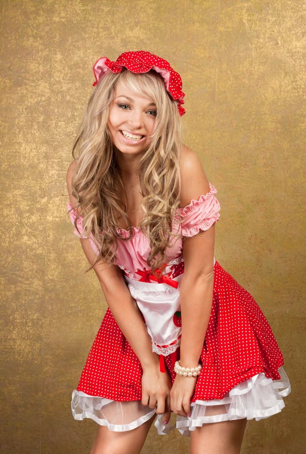 blonde woman in red vintage dress