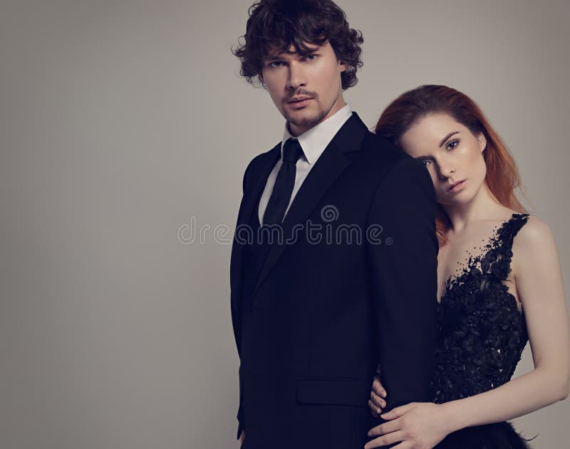 Bright Foxy Hairstyle Emotional Woman in Fashion Black Long Skirt Wedding  Dress Hugging Her Handsome Man in Black Suit Stock Photo - Image of lovers,  elegance: 189865916