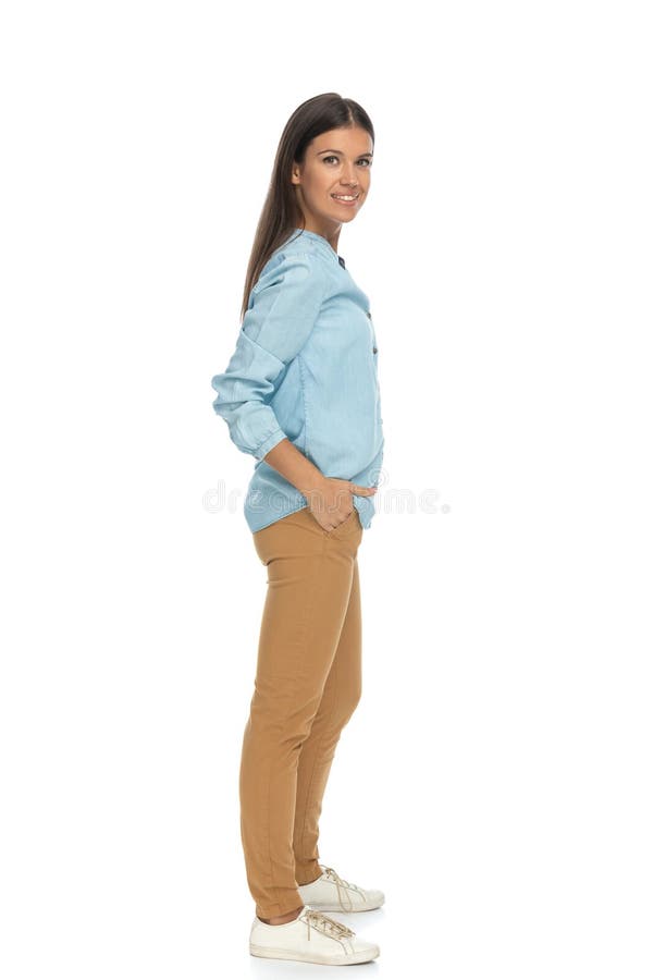 Sexy casual woman posing with one hand in pocket