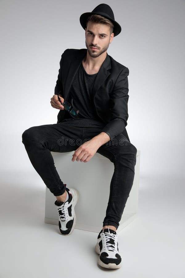 Cool Guy Sitting in a Fashion Pose Stock Image - Image of fashion ...