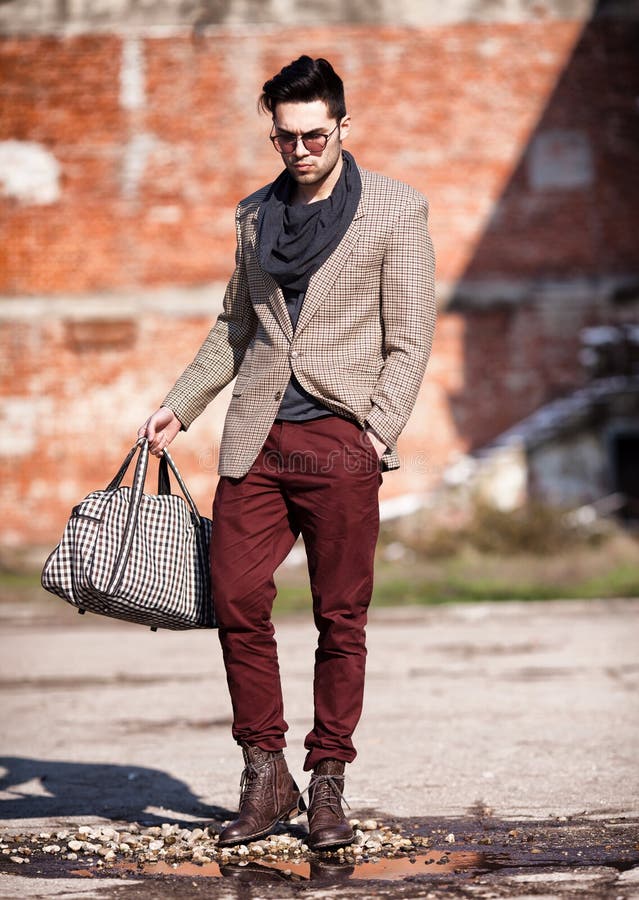 Fashion Man Model Dressed Elegant Holding A Bag Stock Photo - Image of ...