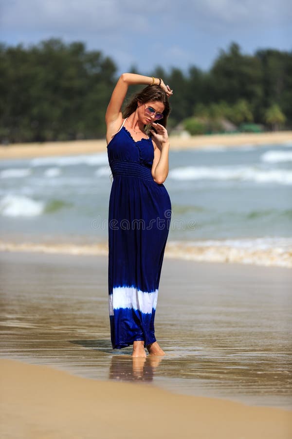 89,400+ Beach Dress Stock Photos, Pictures & Royalty-Free Images - iStock |  Woman walking beach dress, Woman beach dress, Summer beach dress