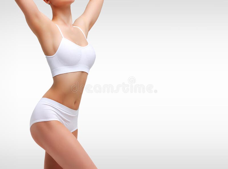 Free Photo  Female body woman with centimeter tape around on white wall.