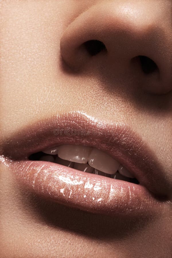 female lips with beige shiny gloss make-up stock photo female lips with beige shiny gloss make-up stock photo