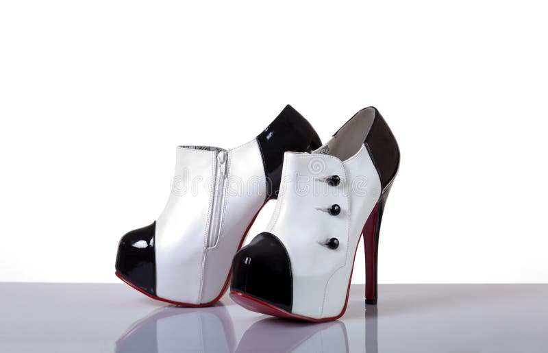 Pair Of New Black Stilettoes Over White. Female New Louboutin Shoes, Back  View. Christian Louboutin Red Soles. Woman Stylish Heels. Stock Photo,  Picture and Royalty Free Image. Image 92922399.