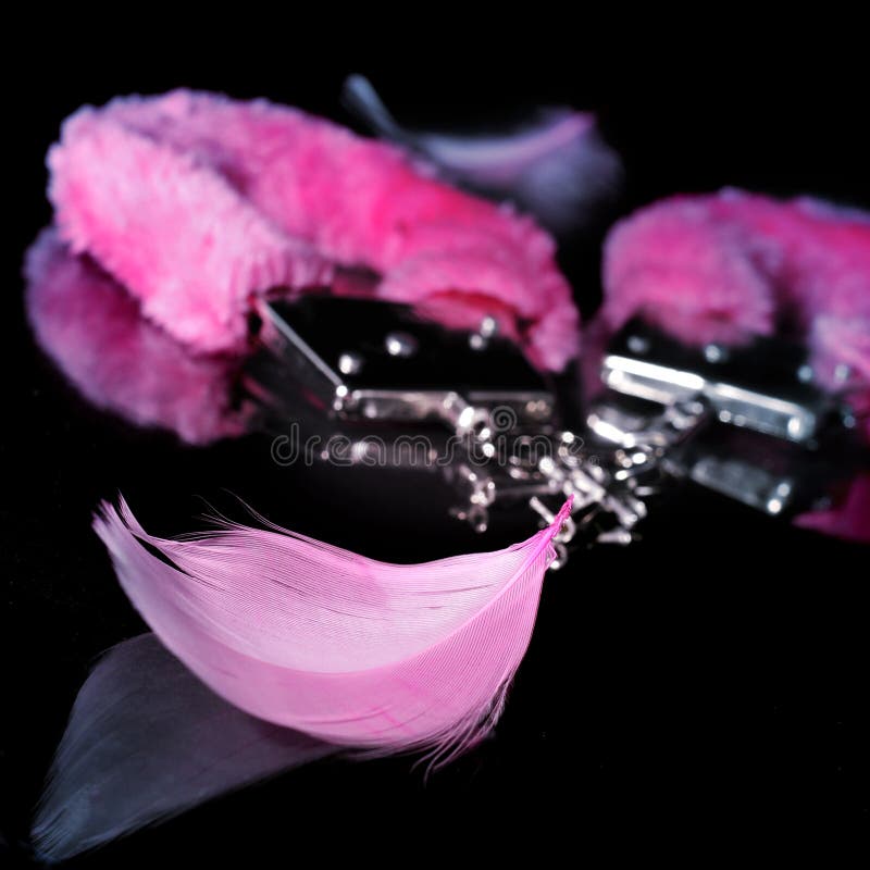 fluffy handcuffs and feathers used as adult toys