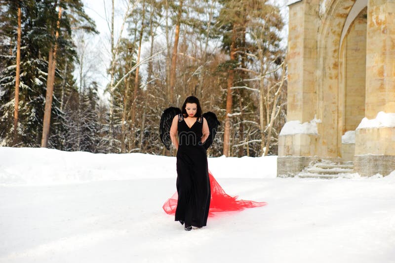 sexy-girl-black-angel-wings-dress-winter-red-flowing-fabric-147519026.jpg
