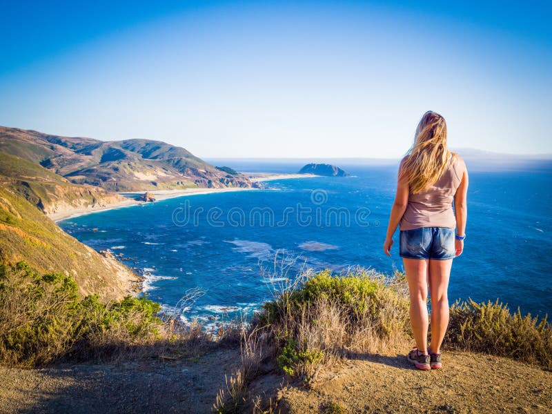 Sexy girl on Highway 1, Bixby Creek Bridge and Big Sur coast California. Bixby Canyon Bridge in California and Big Sur one of most beautiful coastlines in the world. Sexy girl on Highway 1, Bixby Creek Bridge and Big Sur coast California. Bixby Canyon Bridge in California and Big Sur one of most beautiful coastlines in the world.