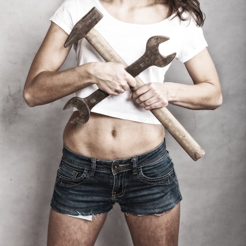 Sex equality and feminism. girl holding hammer and wrench spanner tools. 