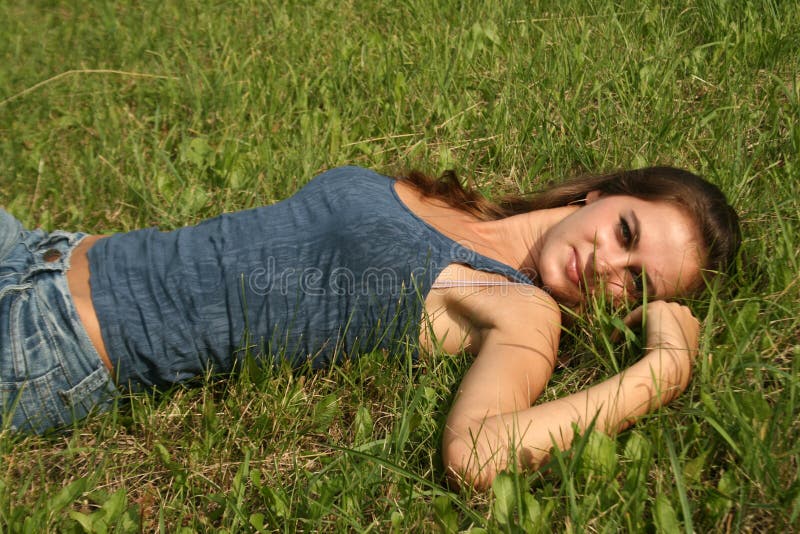 girl resting on grass