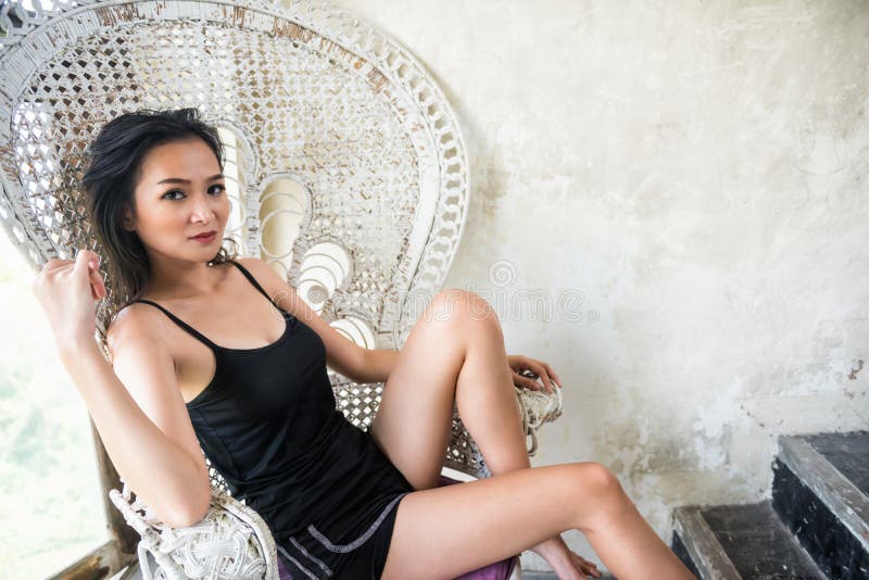 Sexy girl sit on retro chair