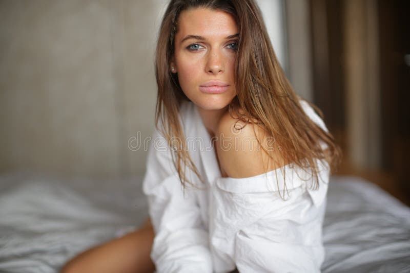 Girl Sitting in a Snow-white Bed. Stock Photo - Image of beautiful, funny:  160788338