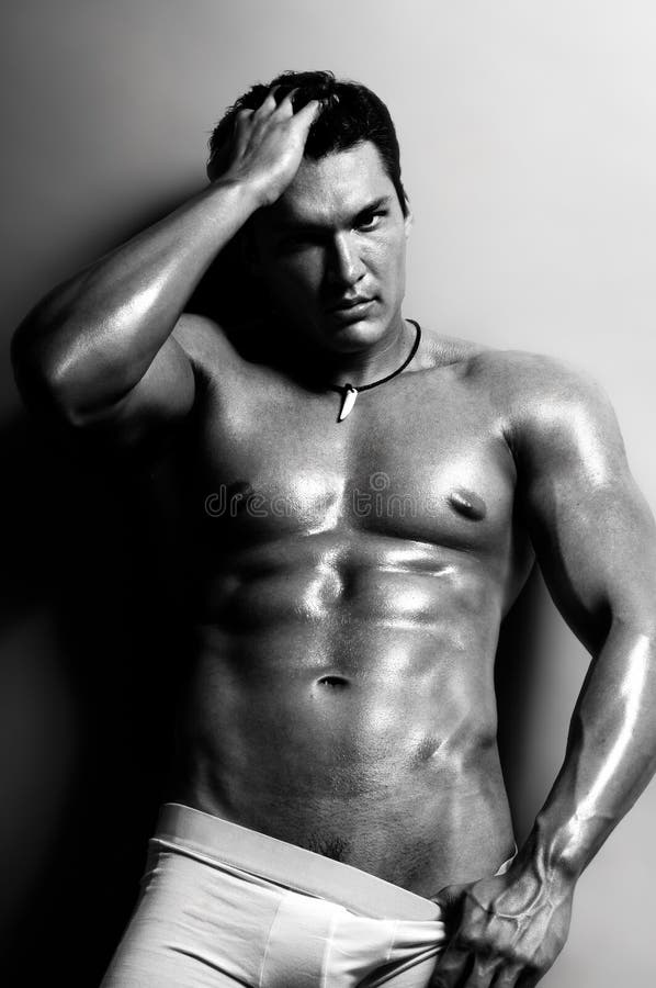 The very muscular undressed handsome guy, black-and-white photo