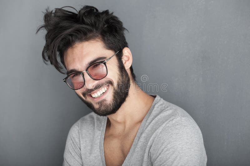 man with beard smiling big against wall stock photos man with beard smiling big against wall stock photos
