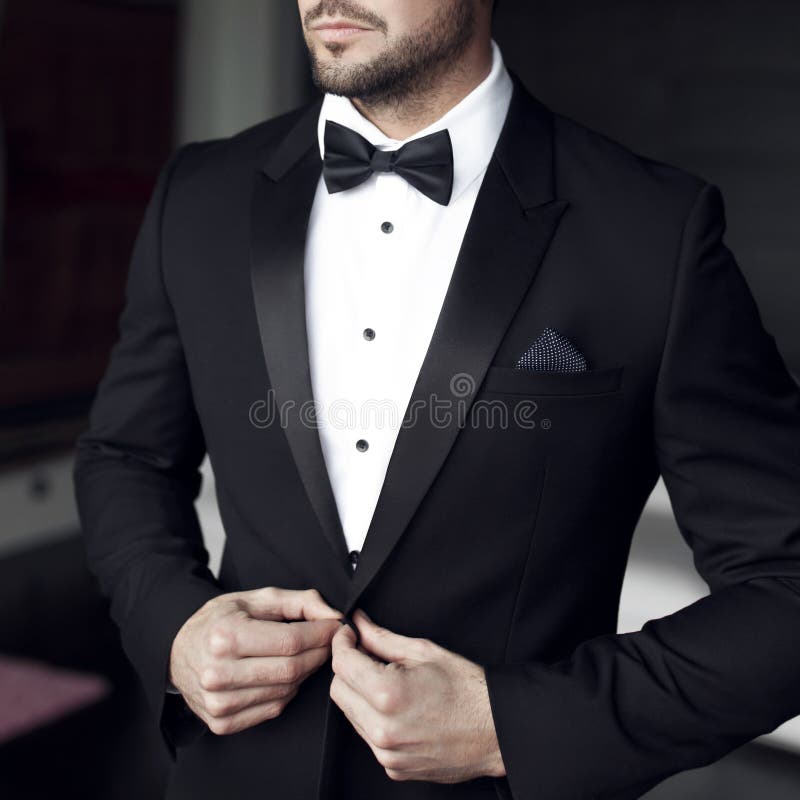 man in tuxedo and bow tie stock photography