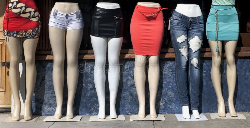 sidewalk torso and leg mannequins modeling tight clothing. sidewalk torso and leg mannequins modeling tight clothing.