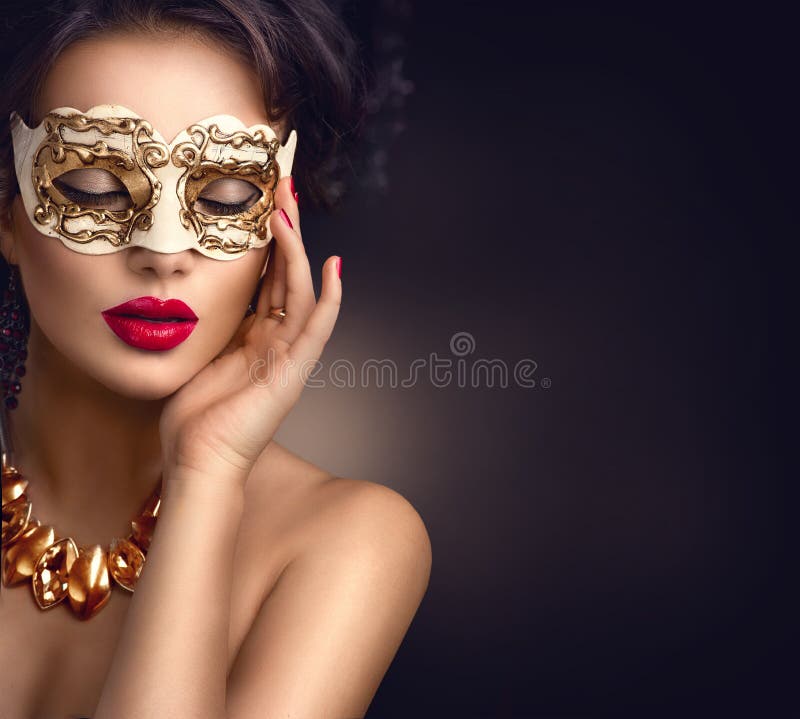 Beauty model woman wearing venetian masquerade carnival mask at party. Christmas and New Year celebration. Beauty model woman wearing venetian masquerade carnival mask at party. Christmas and New Year celebration