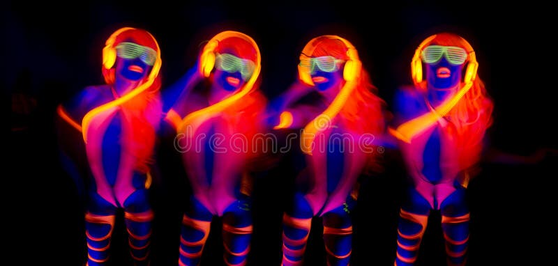 Female disco dancer poses in UV costume. Disco violet light stock images, royalty-free photos and pictures