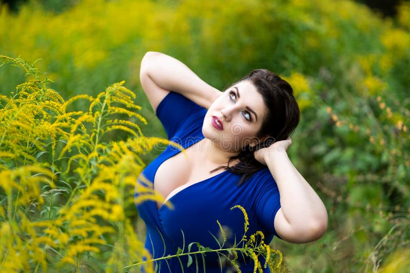 Plus Size Model in Blue Dress with a Deep Neckline Outdoors, Beautiful Fat  Woman with Big Breasts in Nature Stock Image - Image of beauty, loss:  212657321