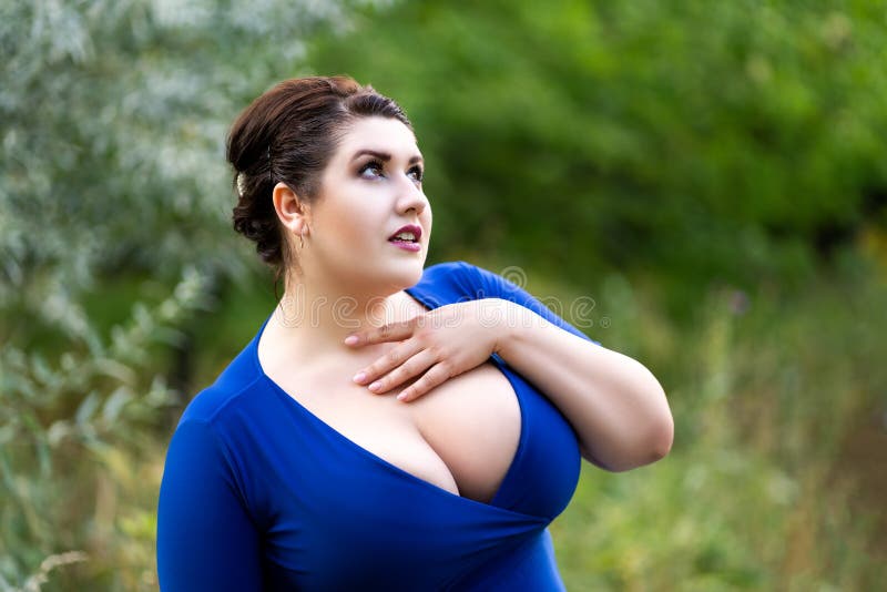 Plus Size Model in Blue Dress with a Deep Neckline Outdoors, Beautiful Fat  Woman with Big Breasts in Nature Stock Image - Image of beauty, loss:  212657321