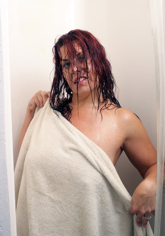 Redhead in the Shower (1). A redhead emerges from the shower covered by a t...