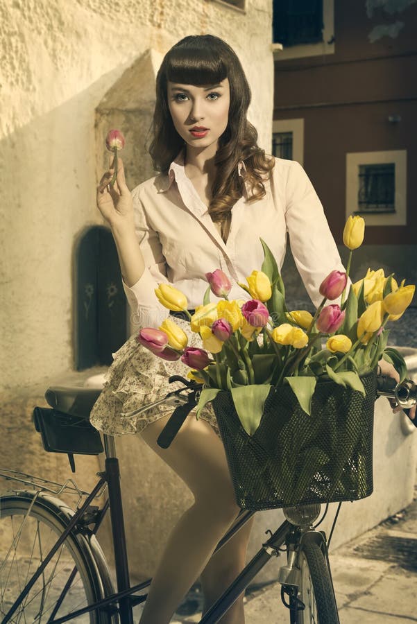 Retro Pin Up On Bike In Old Town With Tulips Royalty Free Stock Images Image 31242279