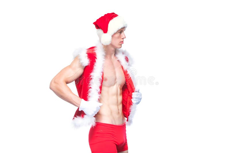 Santa Claus . Young muscular man wearing Santa Claus hat demonstrate his muscles. Isolated on white background. stock image Santa Claus . Young muscular man wearing Santa Claus hat demonstrate his muscles. Isolated on white background. stock image