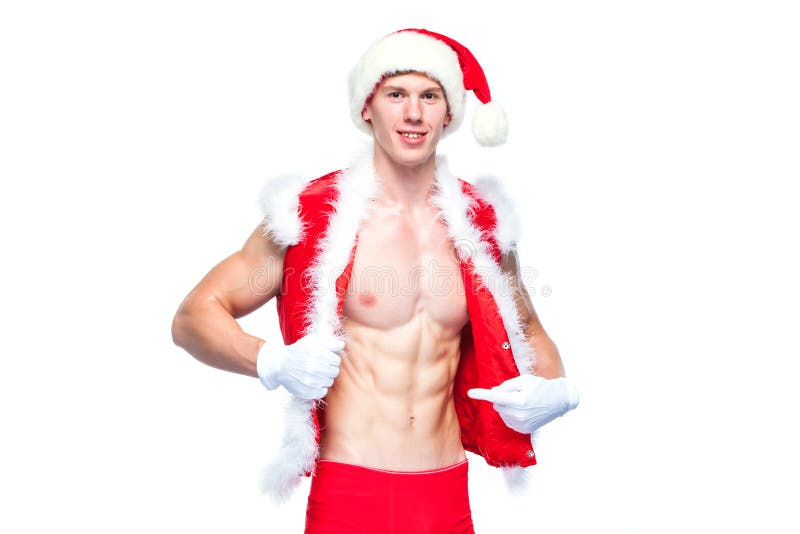Santa Claus . Young muscular man wearing Santa Claus hat demonstrate his muscles. Isolated on white background. stock photo Santa Claus . Young muscular man wearing Santa Claus hat demonstrate his muscles. Isolated on white background. stock photo